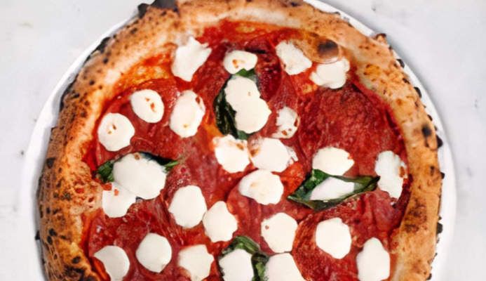 Marketing photo of a double pepperoni pizza.